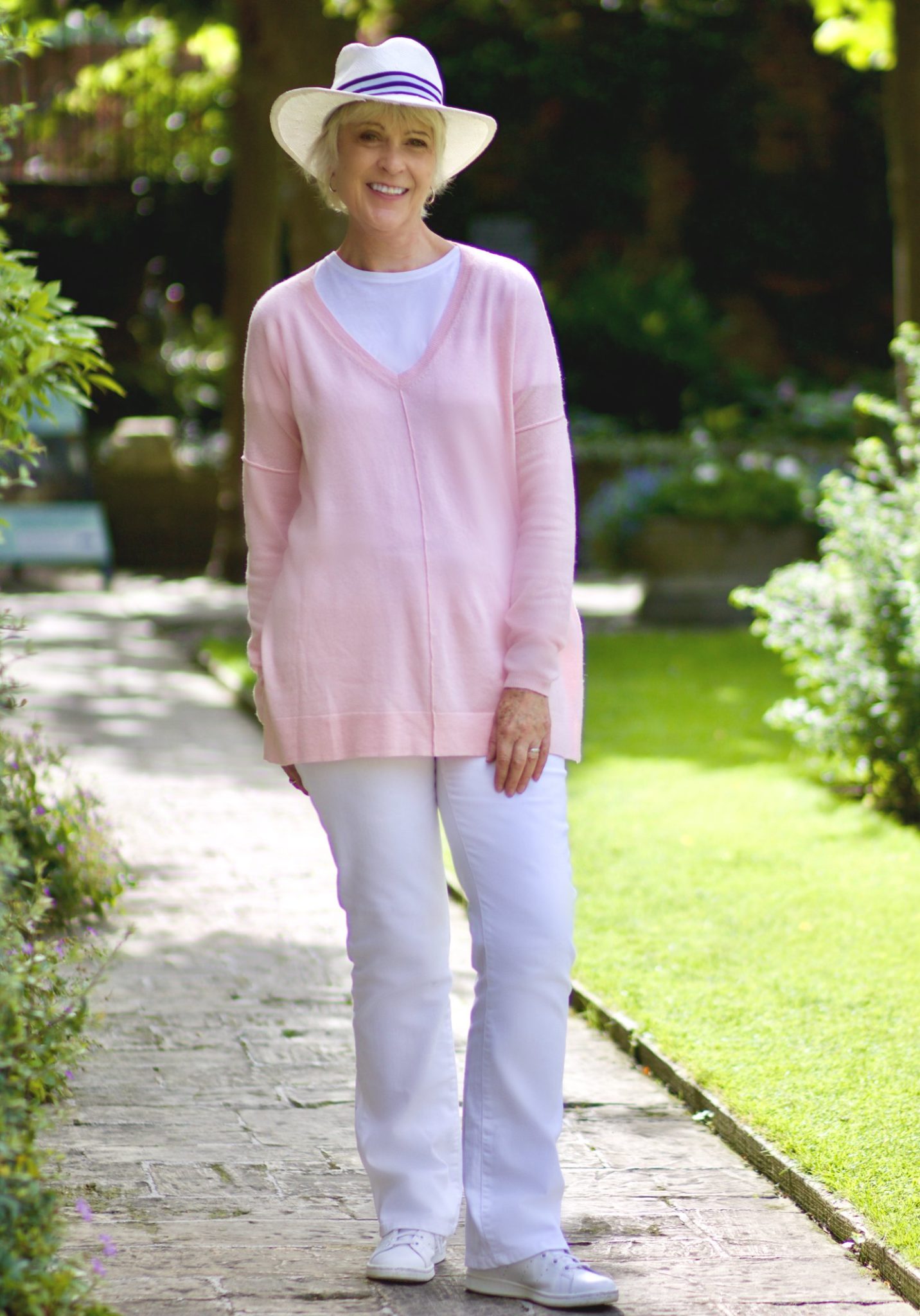 Pink sweater and white jeans