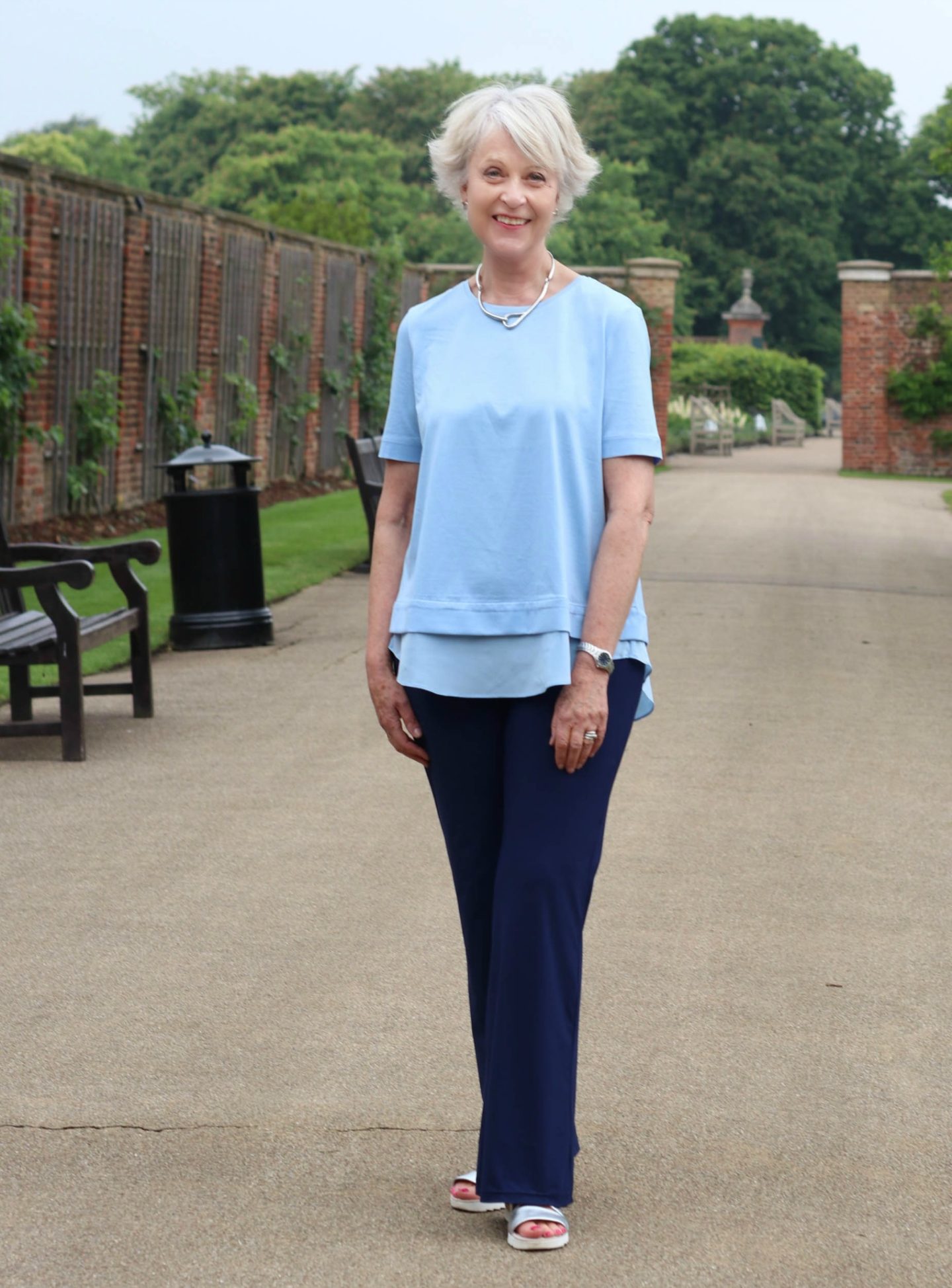 Blue Cos top and navy trousers