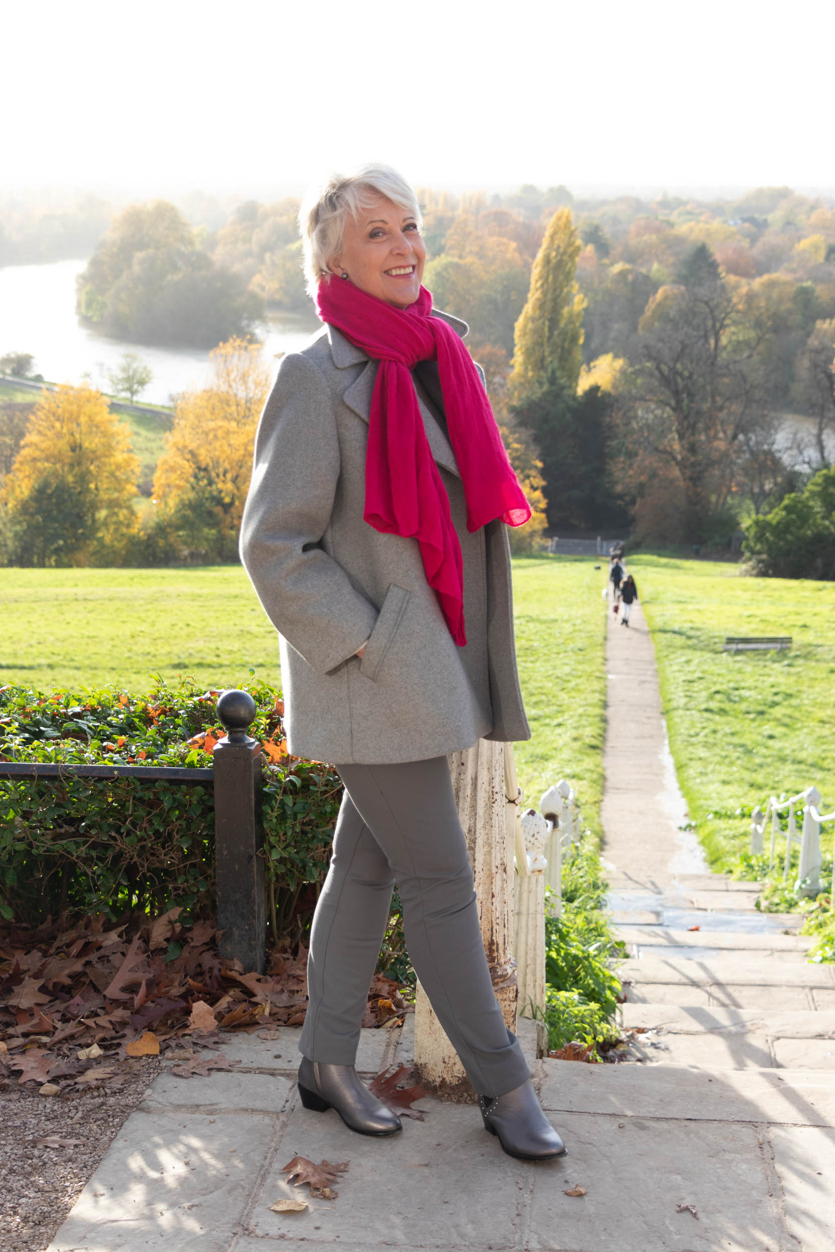 Grey pea coat and pink wool scarf