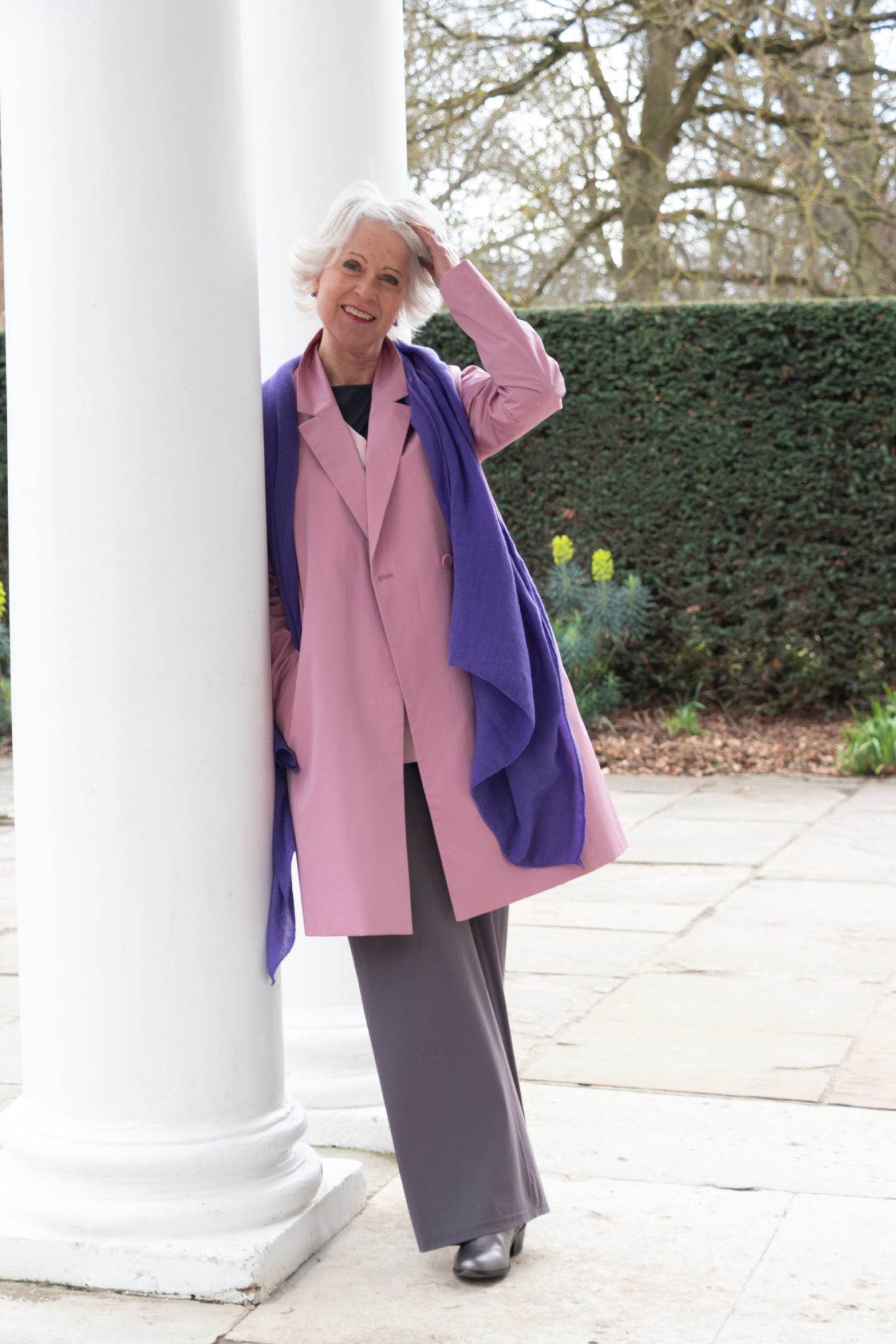 pink coat and purple scarf