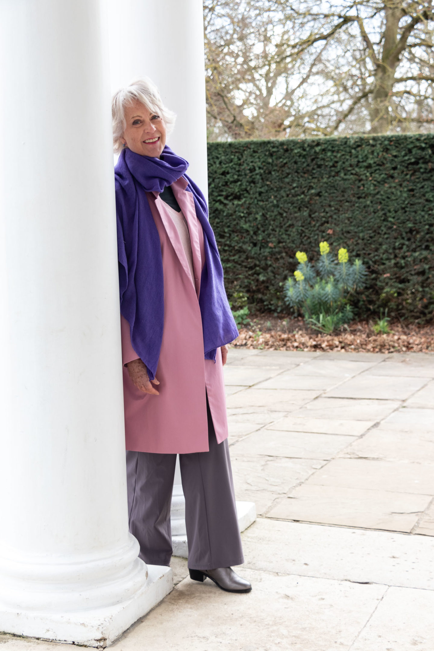 pink coat and purple scarf