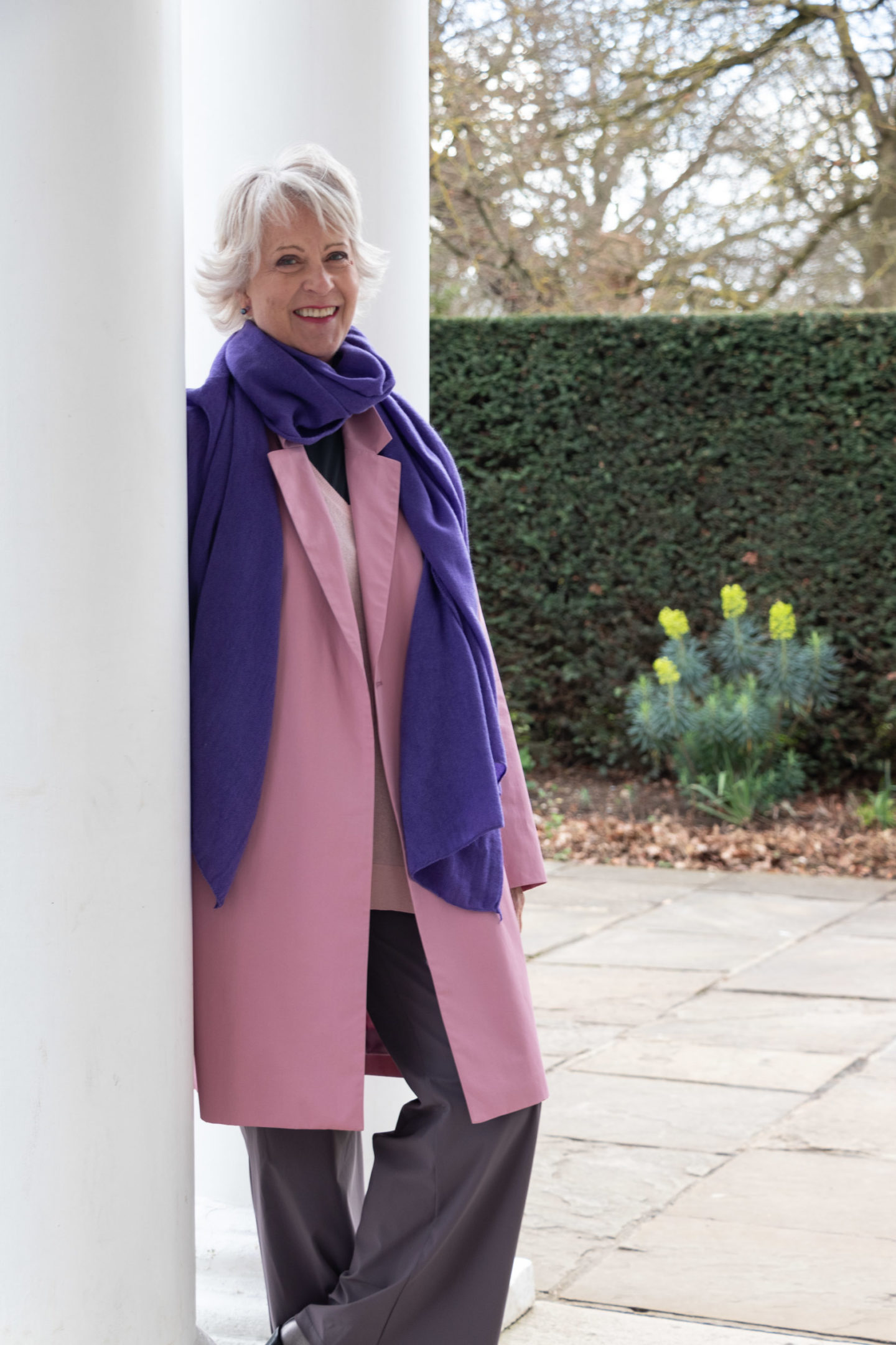 pink coat and purple scarf
