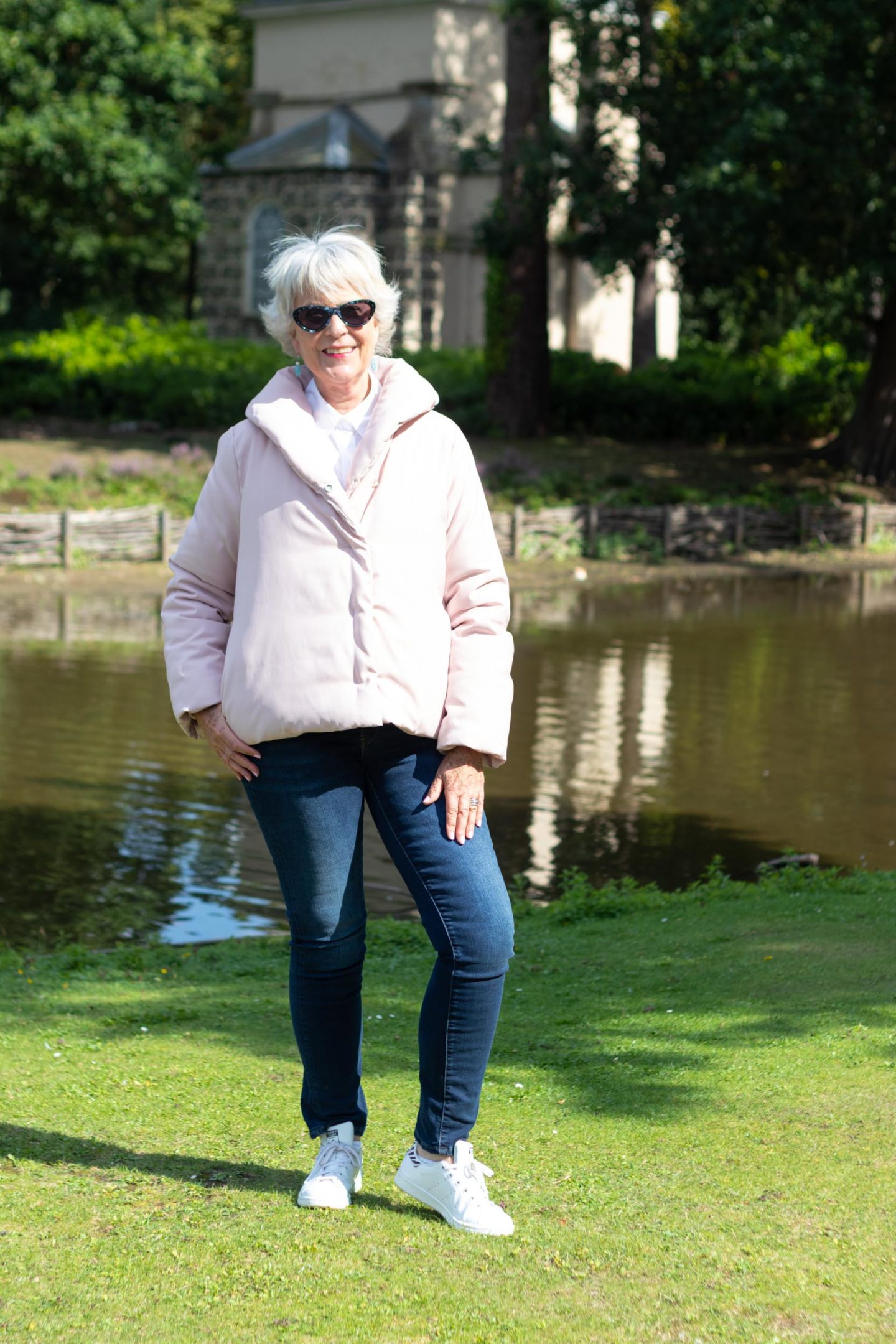Pale pink puffa jacket and jeans