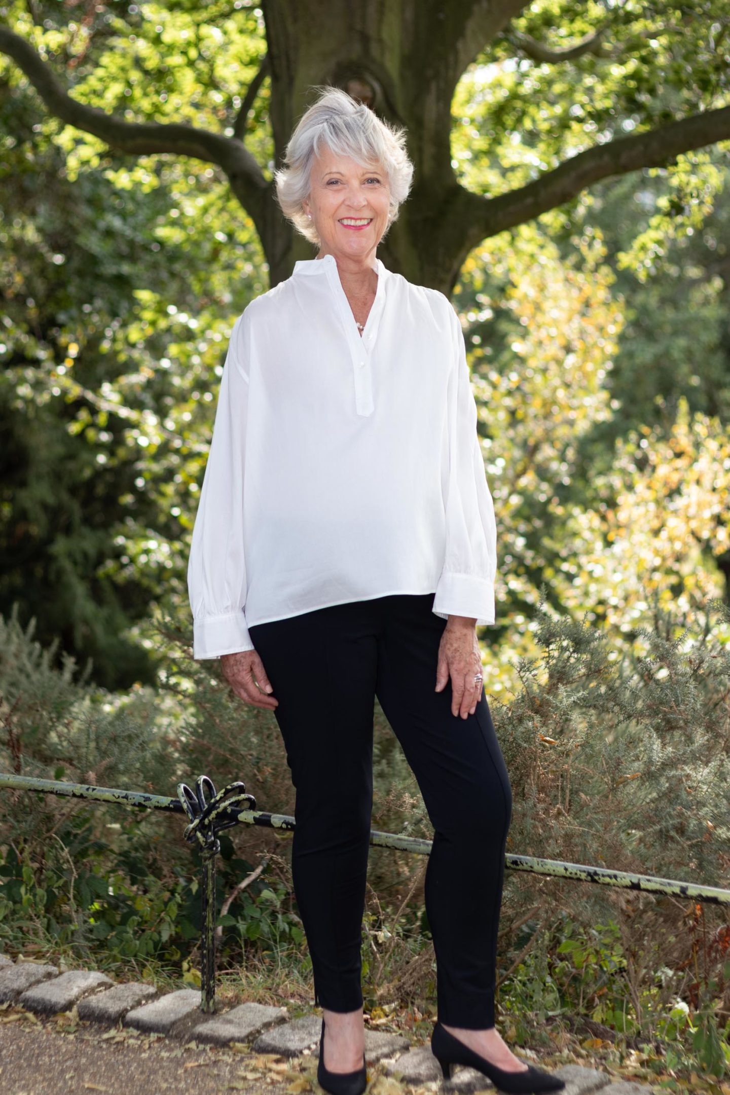 White top and black trousers