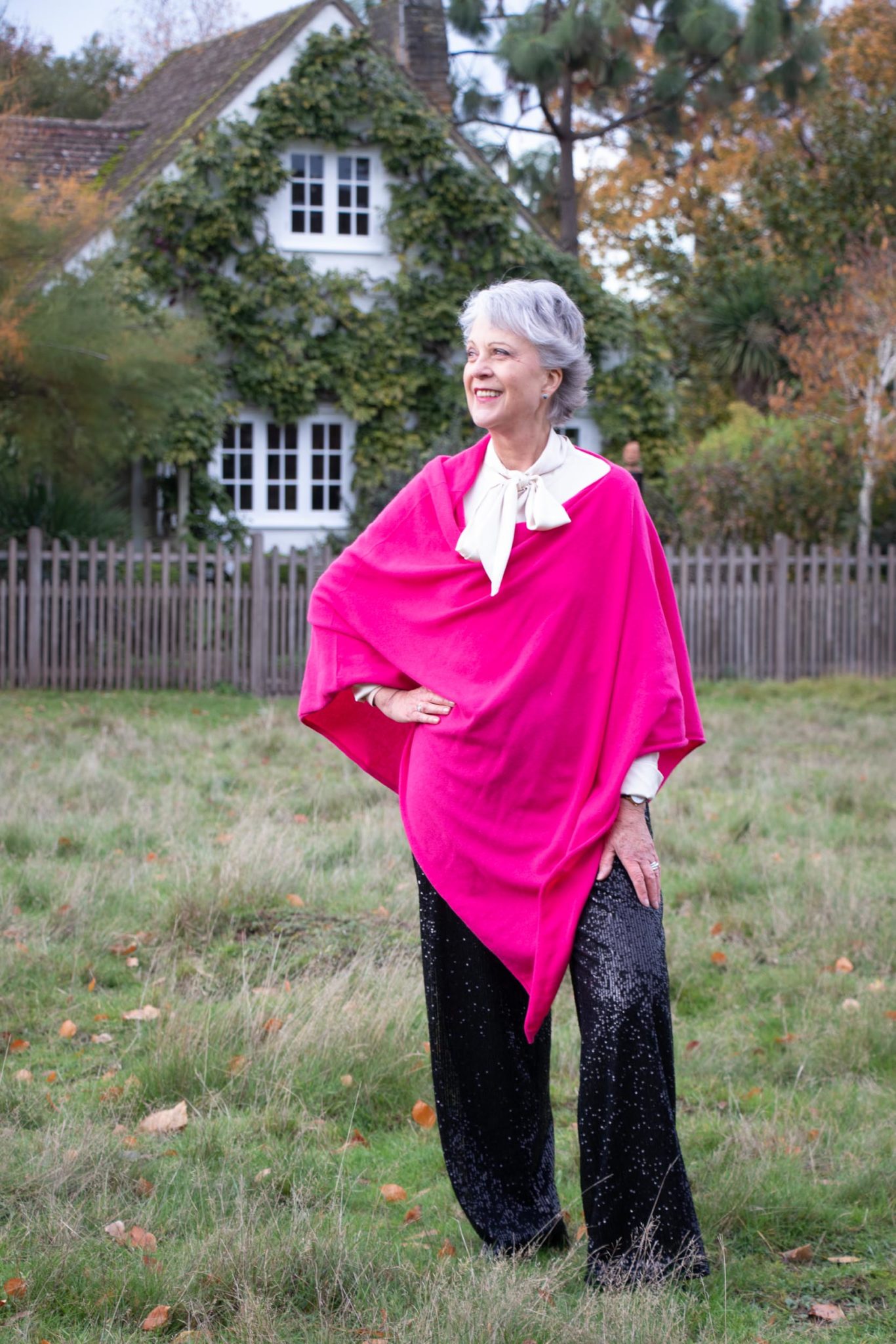 Black sequin trousers pink cashmere poncho