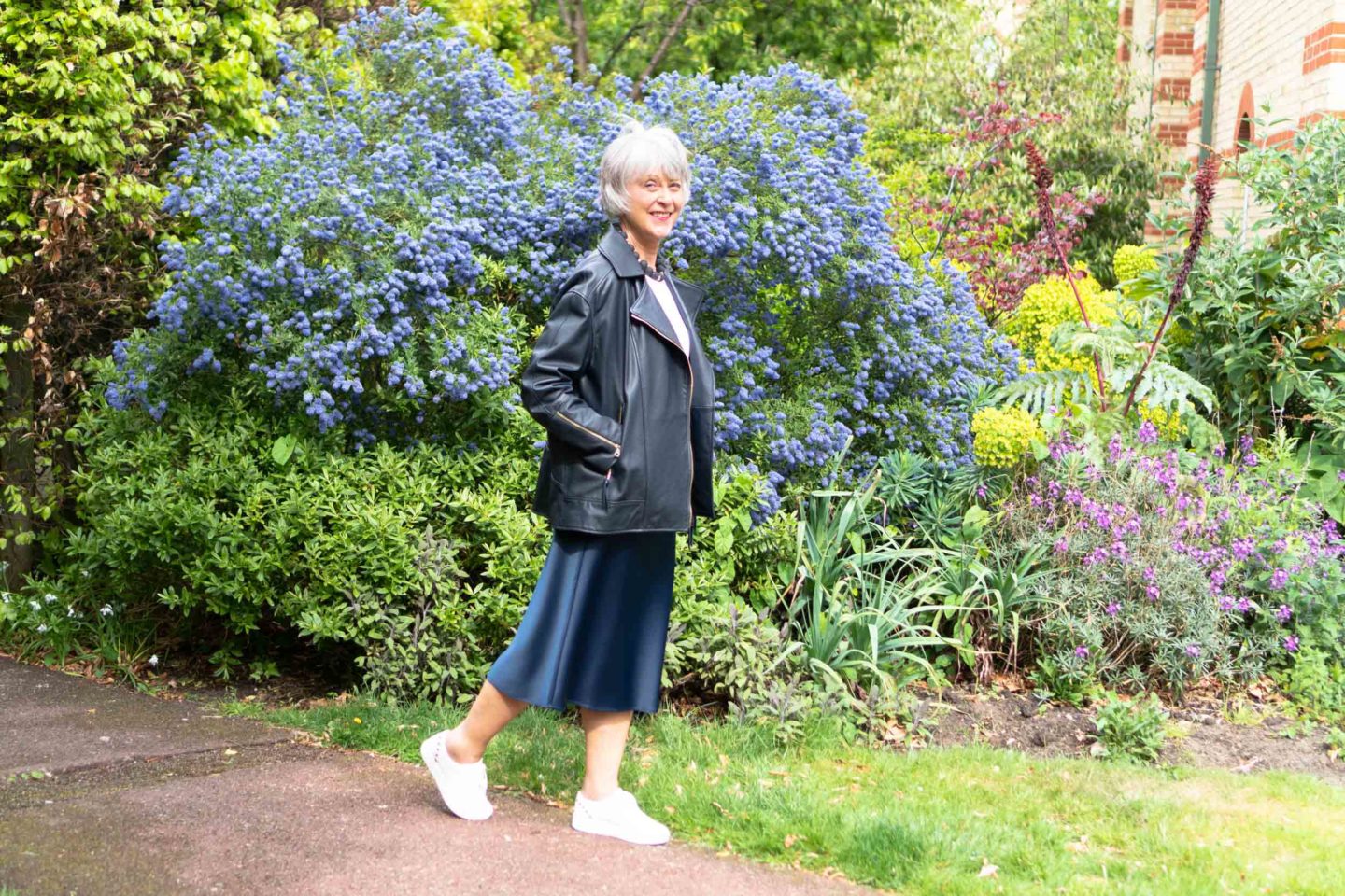 Leather jacket and navy satin skirt