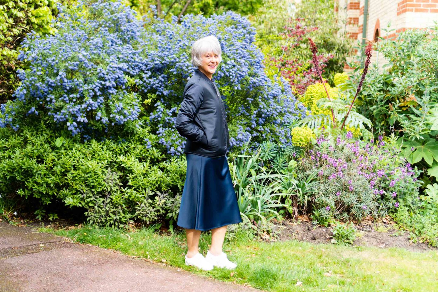cropped jacket and navy satin skirt