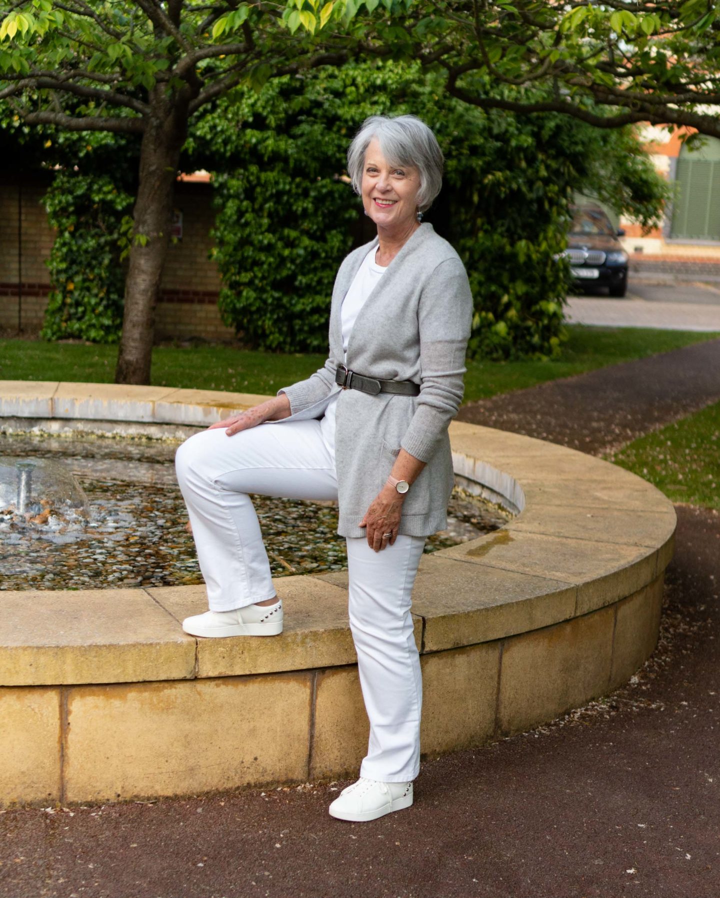 White jeans and grey cashmere cardigan