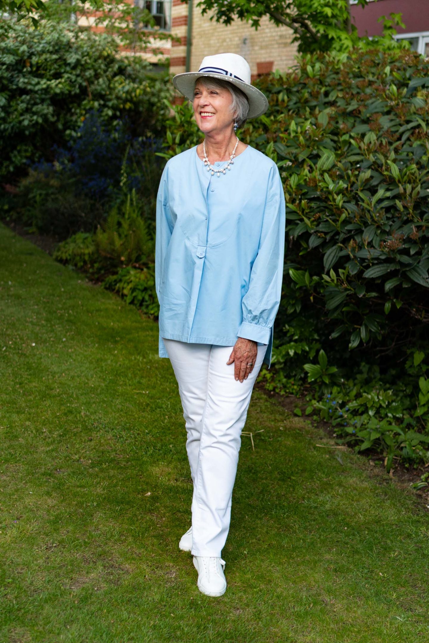 White jeans and blue cotton top