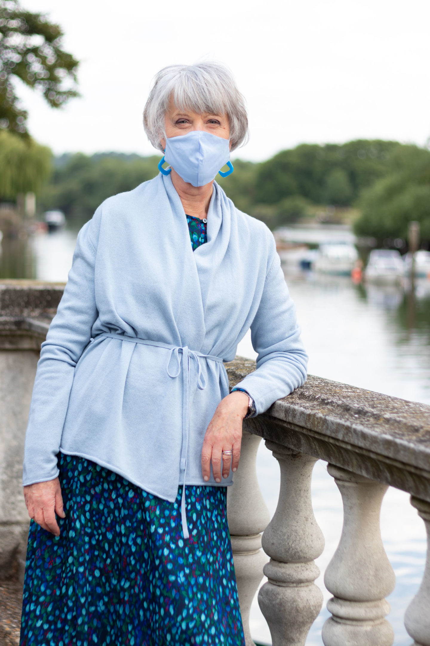 Pale blue cashmere cardigan and print skirt