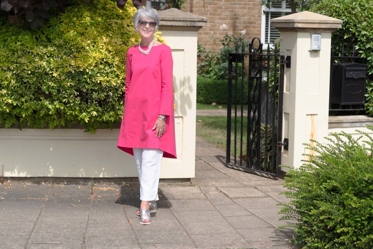 Pink dress and white trousers