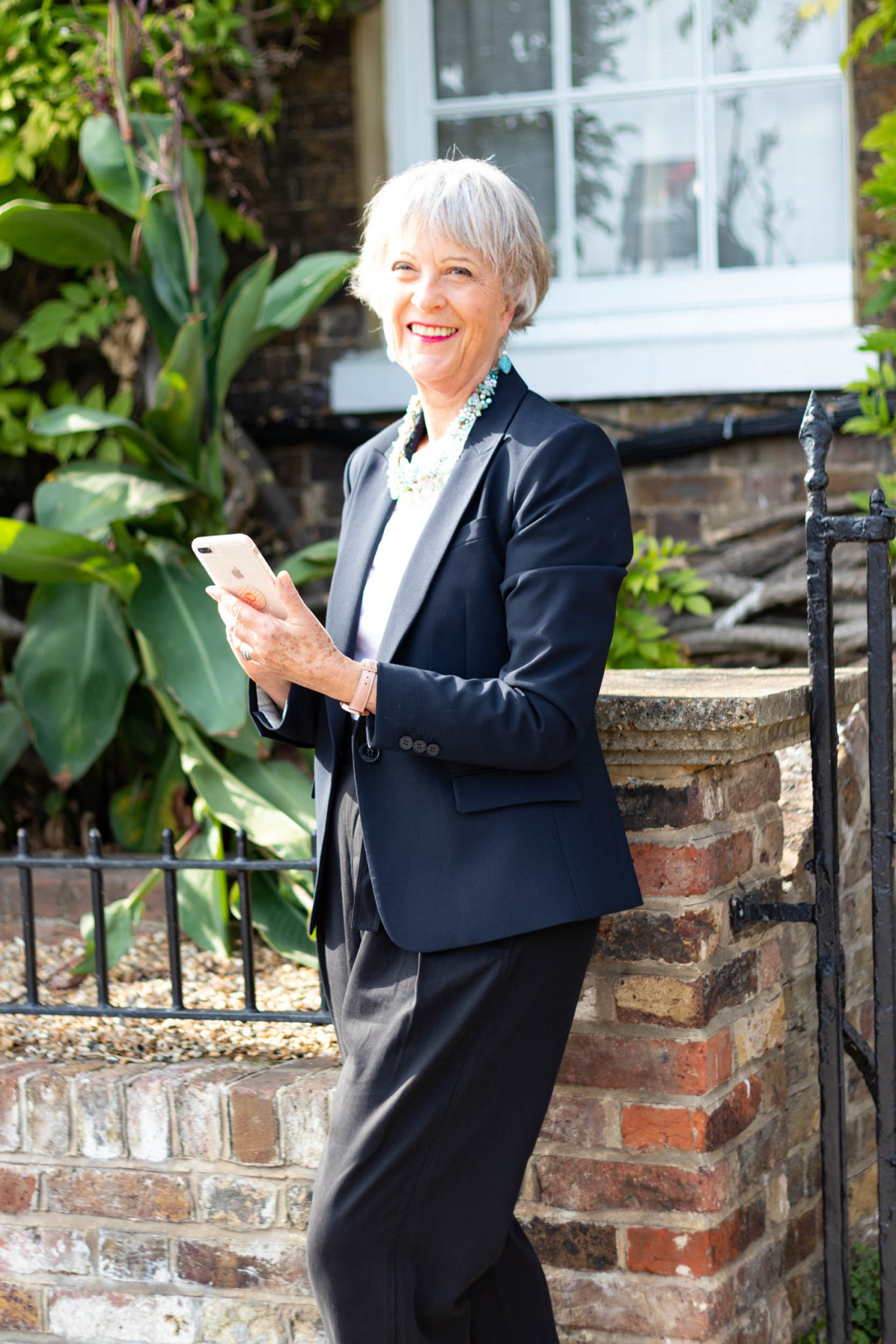 Classic navy jacket teamed with casual black trousers - Chic at any age