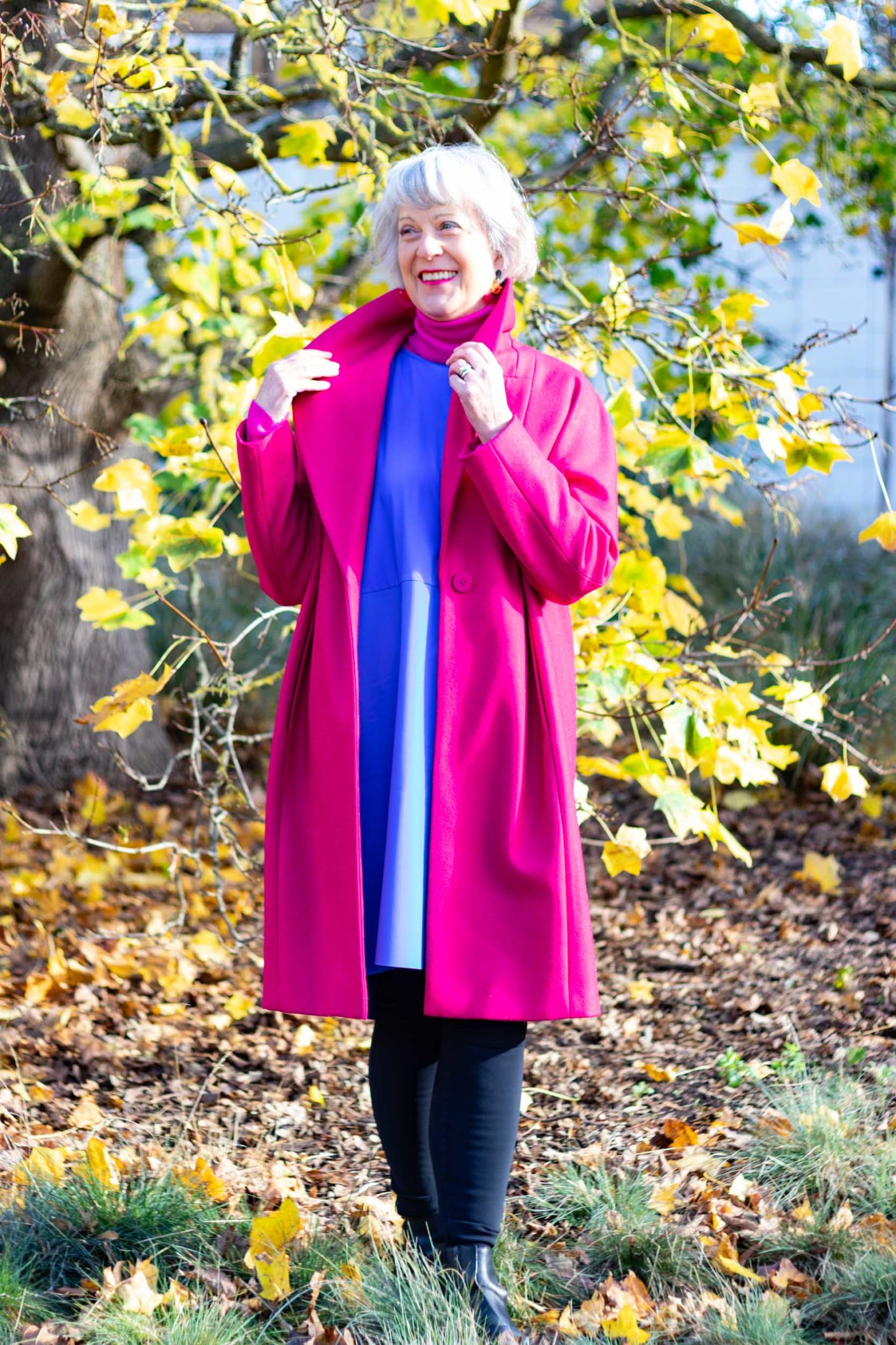 Bright pink coat and blue dress