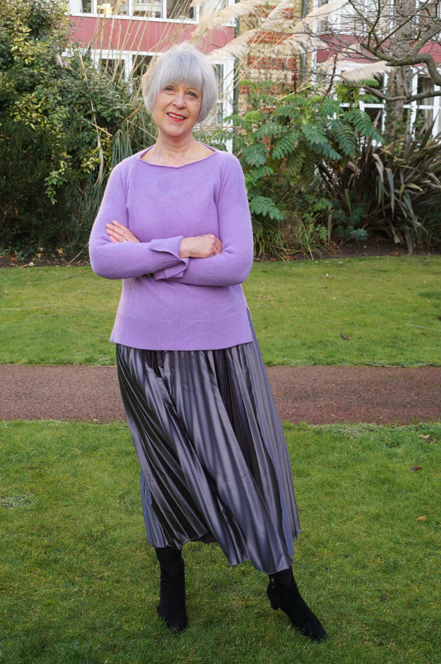 How to look after grey hair. Purple sweater and grey pleated skirt.