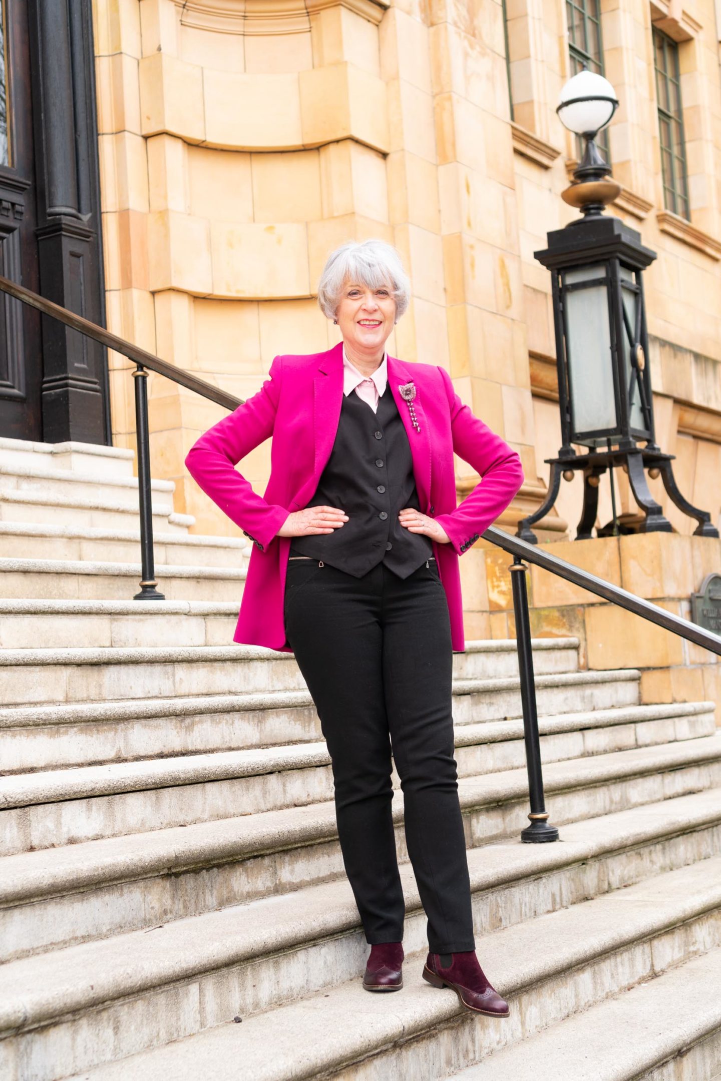 Pink blazer, black waistcoat and trousers