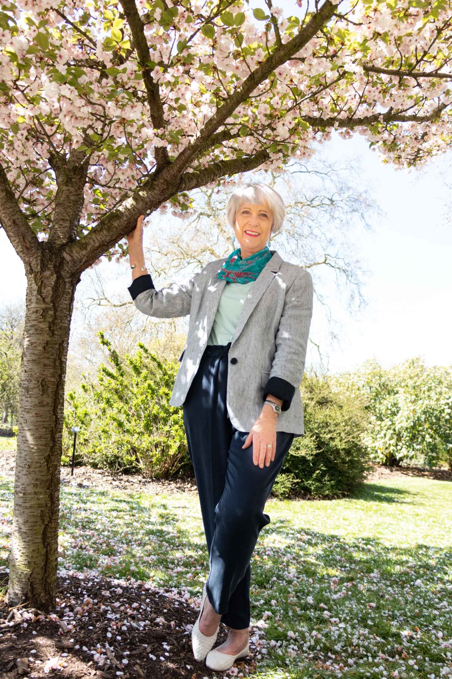 Linen jacket and navy trousers with a touch of colour