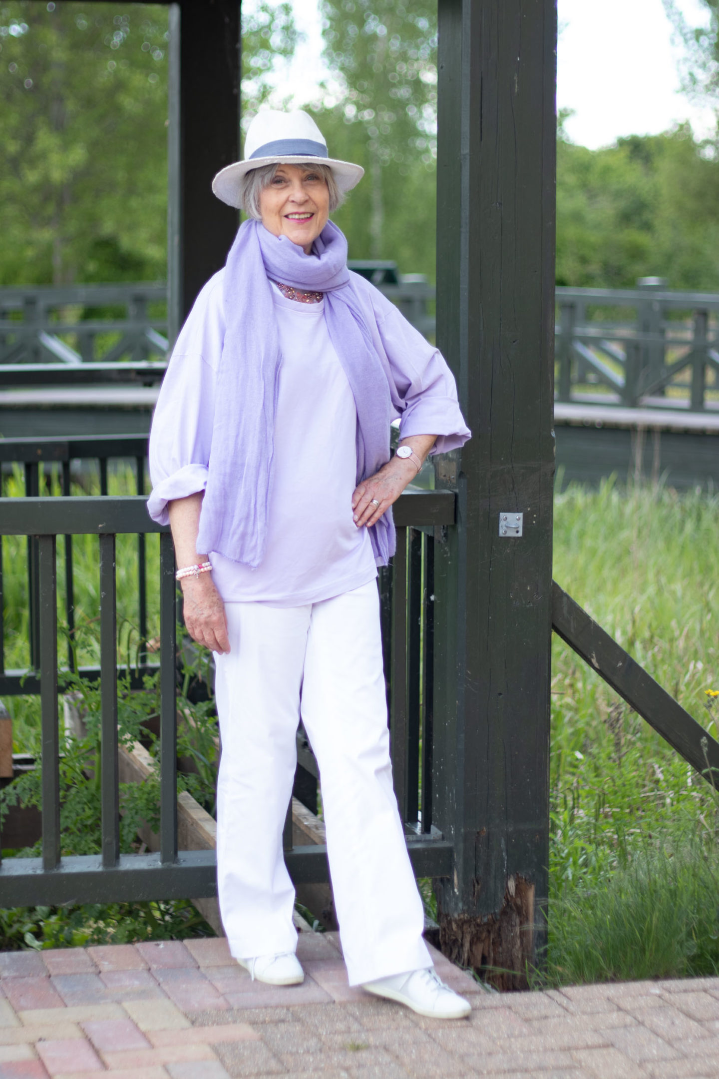 White trousers and lilac top