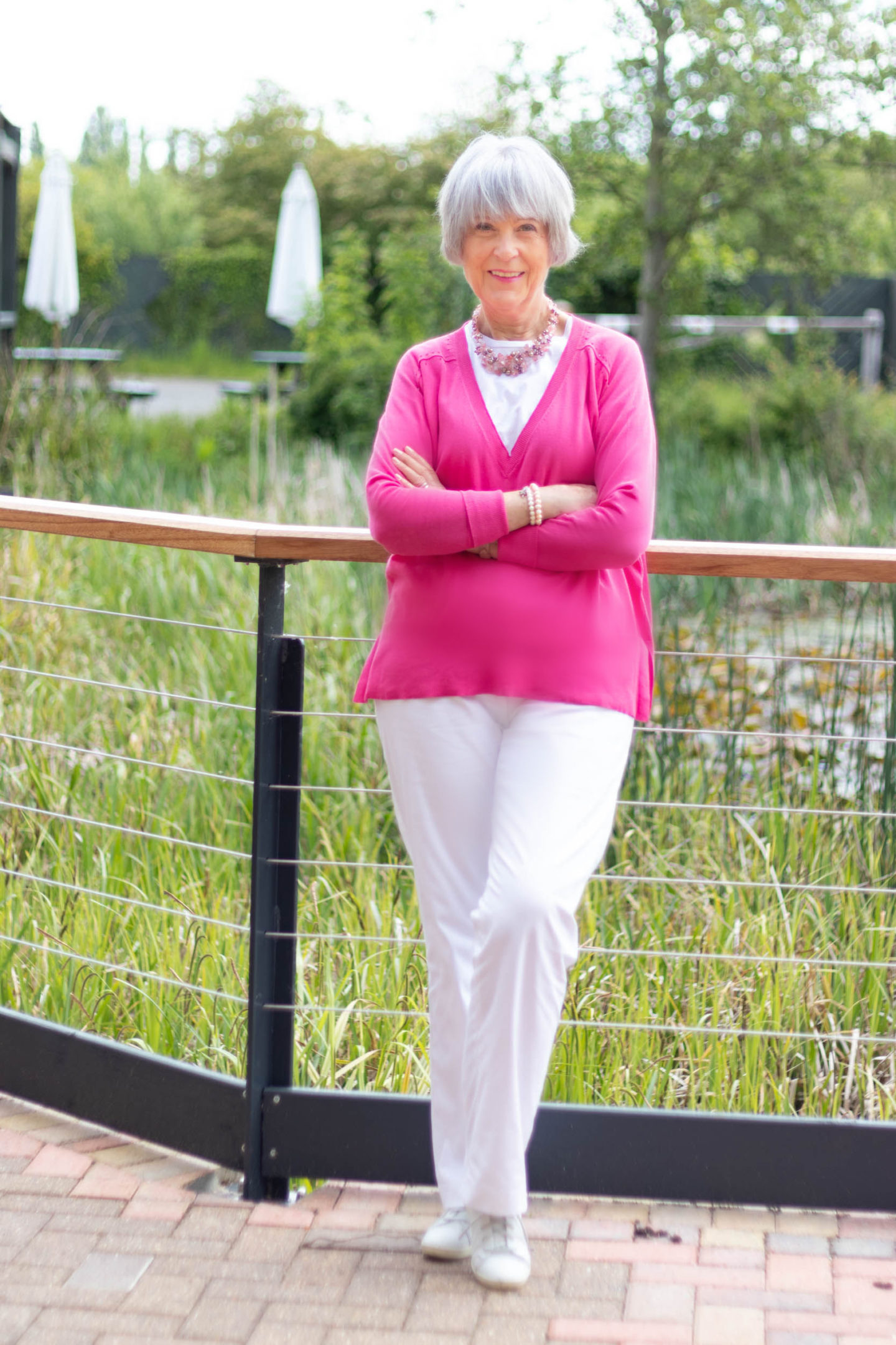 White cotton trousers, tee and V neck pink sweater