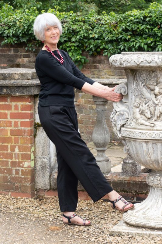Black trousers and black tee shirt