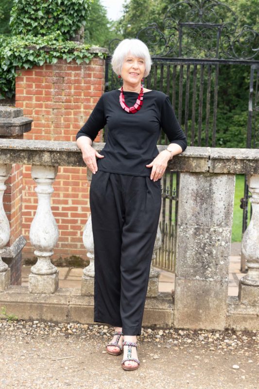A monochrome outfit with bold accessories