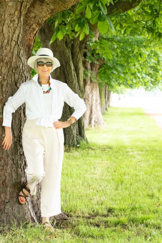 Oversize white shirt and beige trousers
