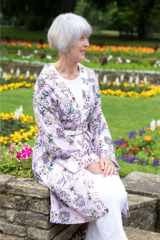 Pink print robe worn with white jeans and white tee.