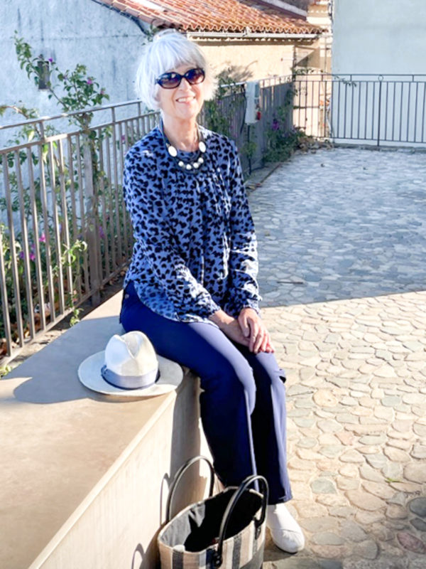 Blue animal print top and navy wide leg trousers