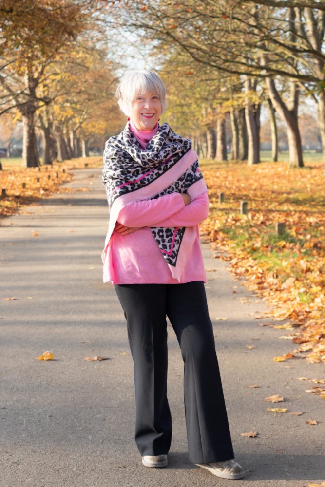 Pink sweater and pink leopard print scarf