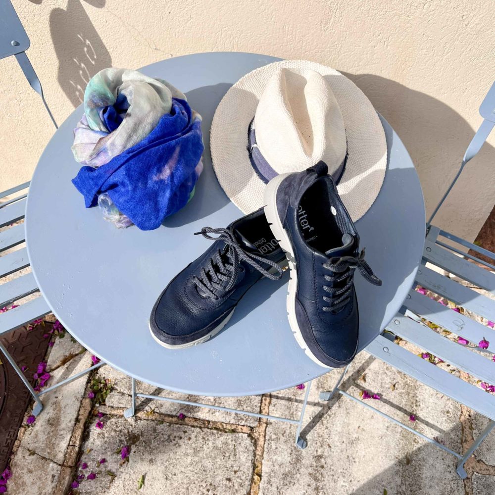 detail of navy Hotter shoes, scarf and hat