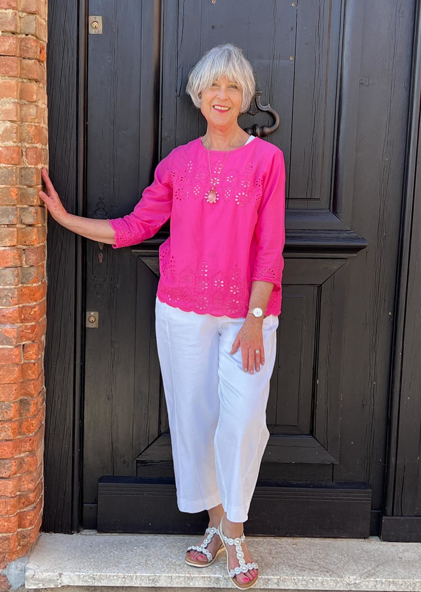 Pink broderie top and white trousers