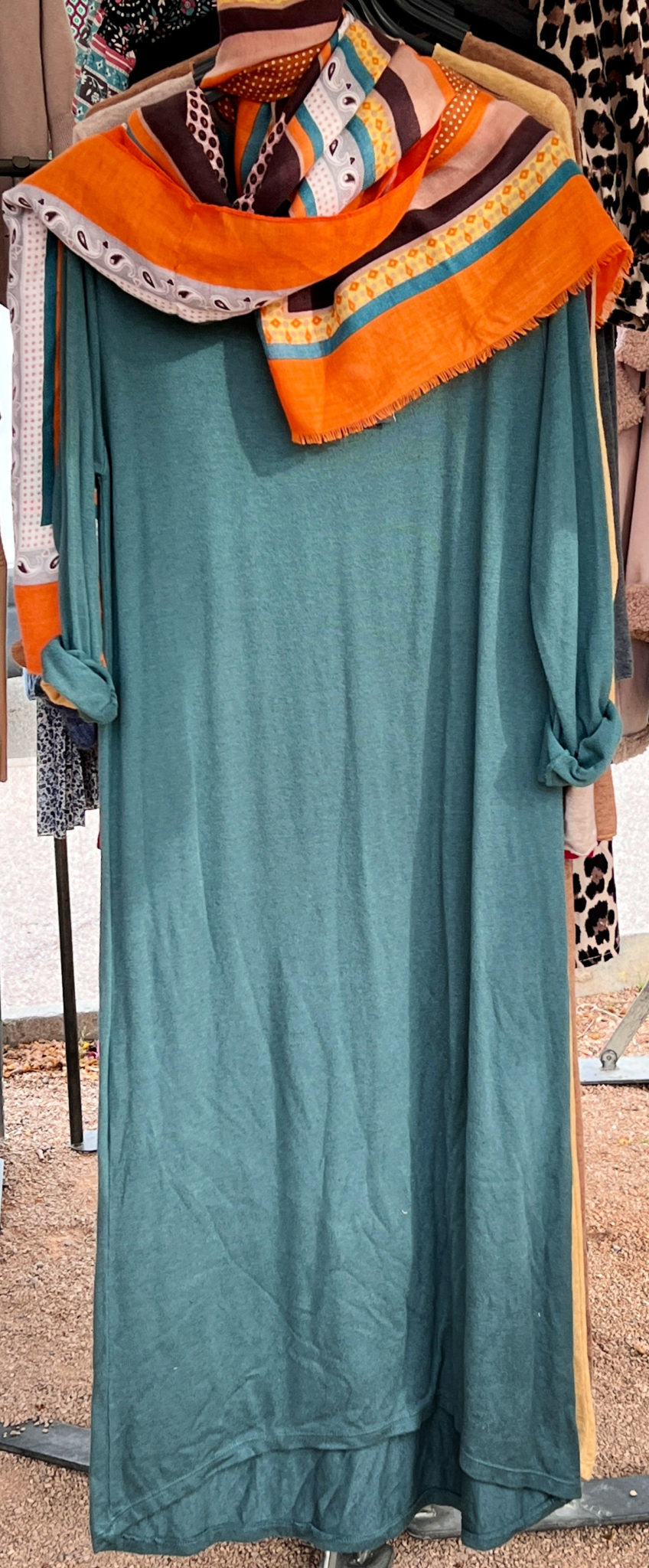 Green maxi dress with bright orange scarf