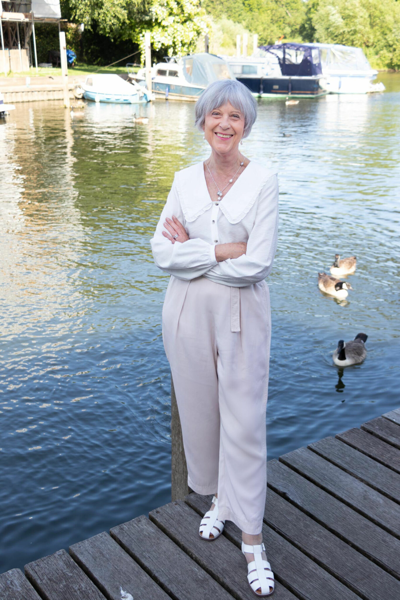 How to wear a simple white blouse with beige trousers