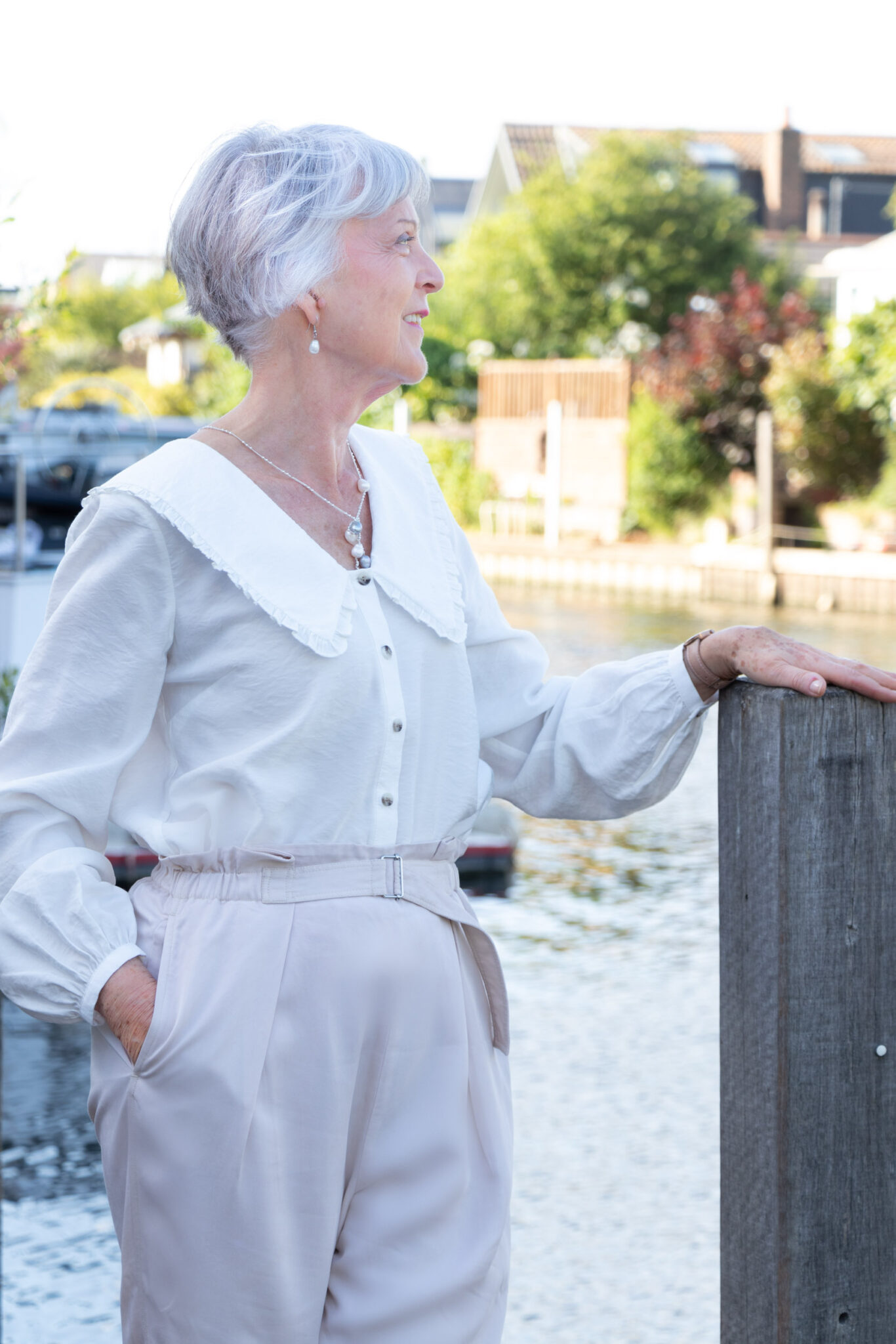 How to wear a simple white blouse with beige trousers