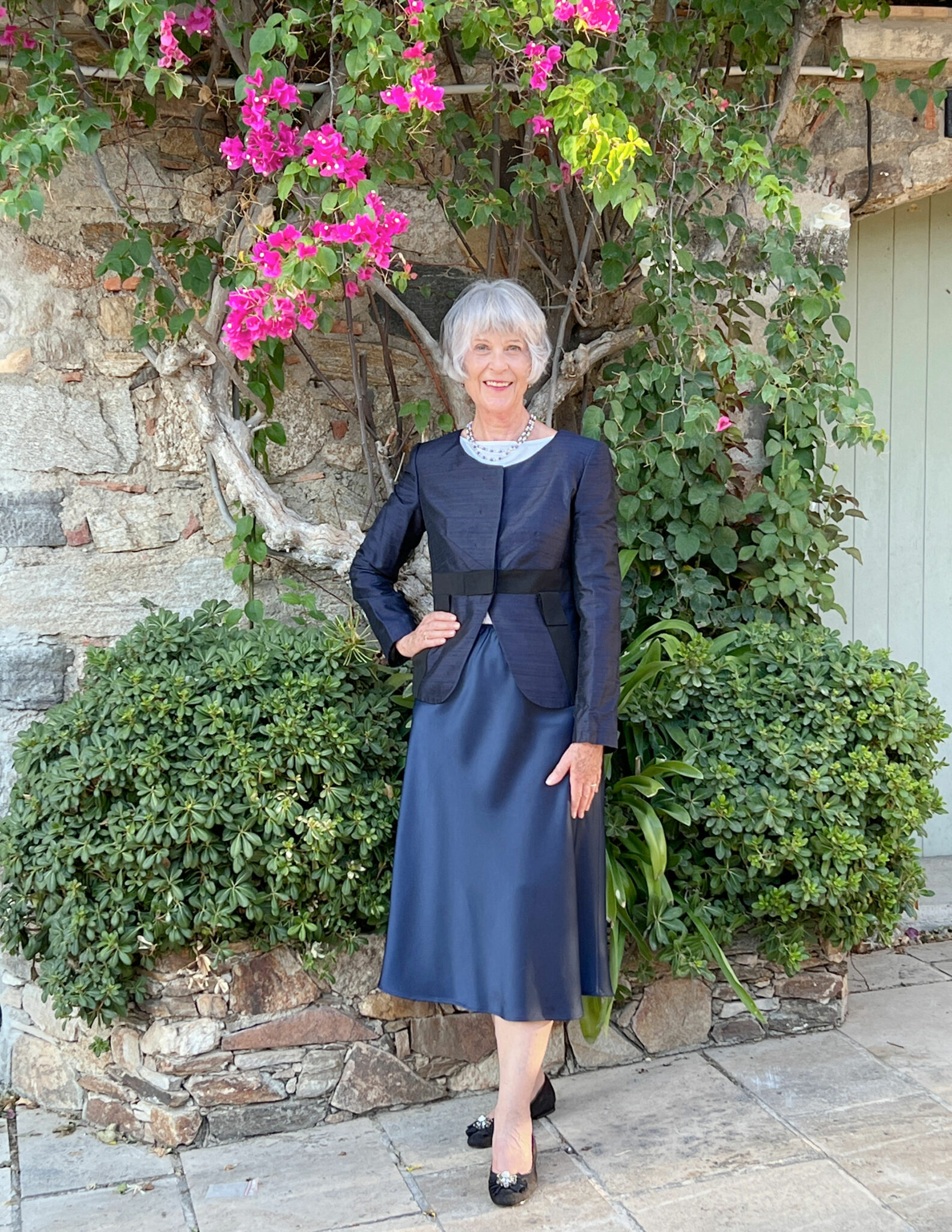 Navy bias cut skirt teamed with Armani jacket