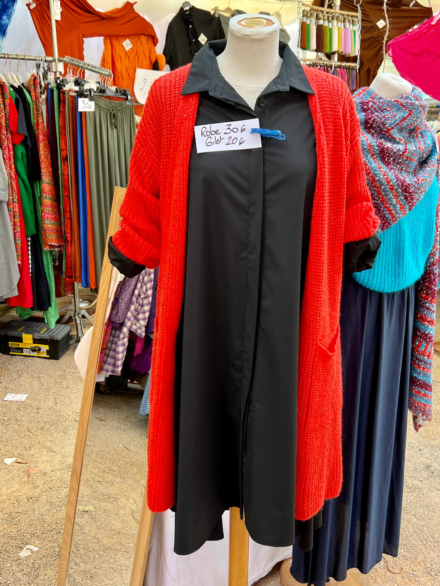 Red cardigan and black dress St.Tropez market