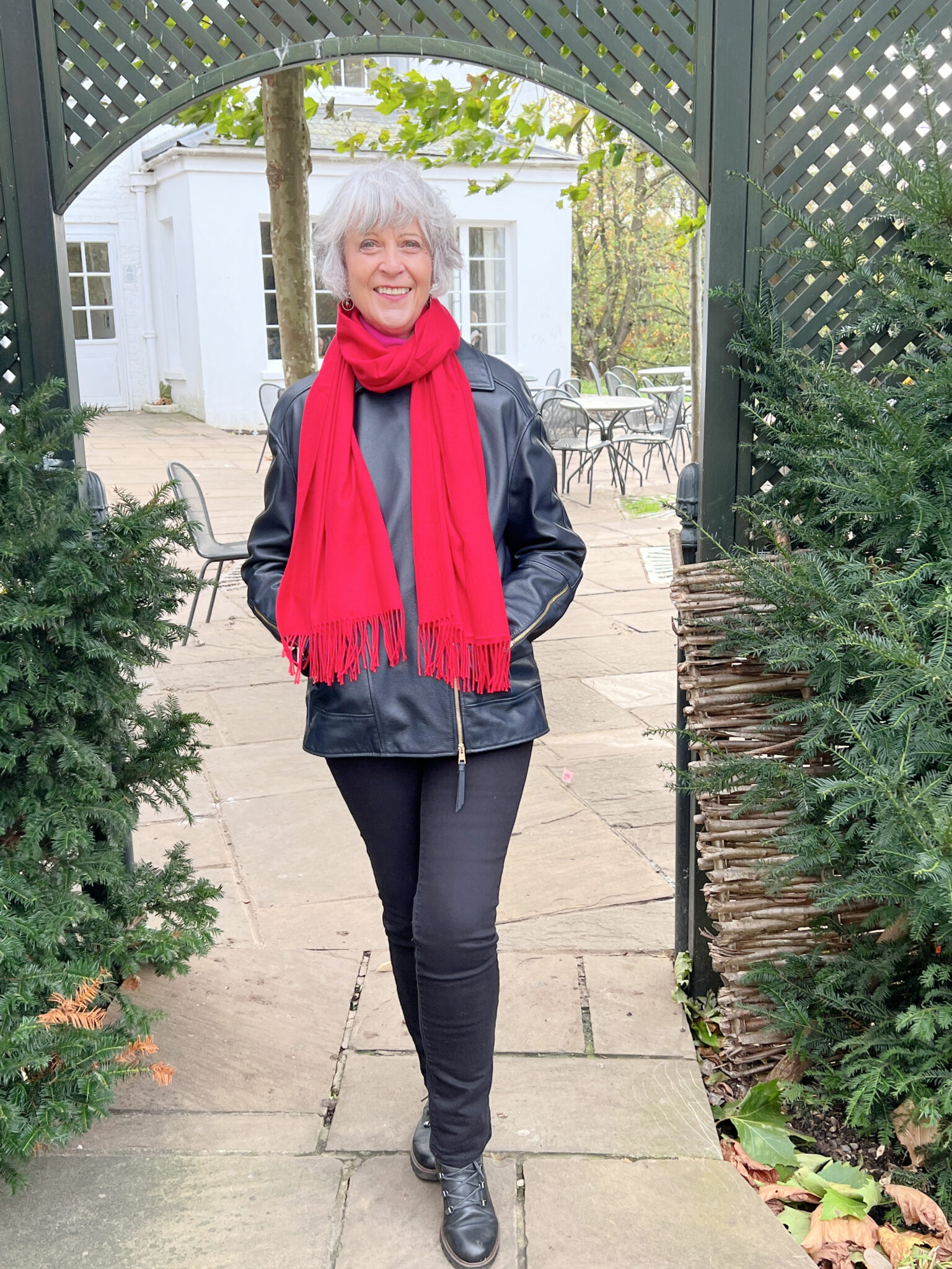 Black jacket and red scarf