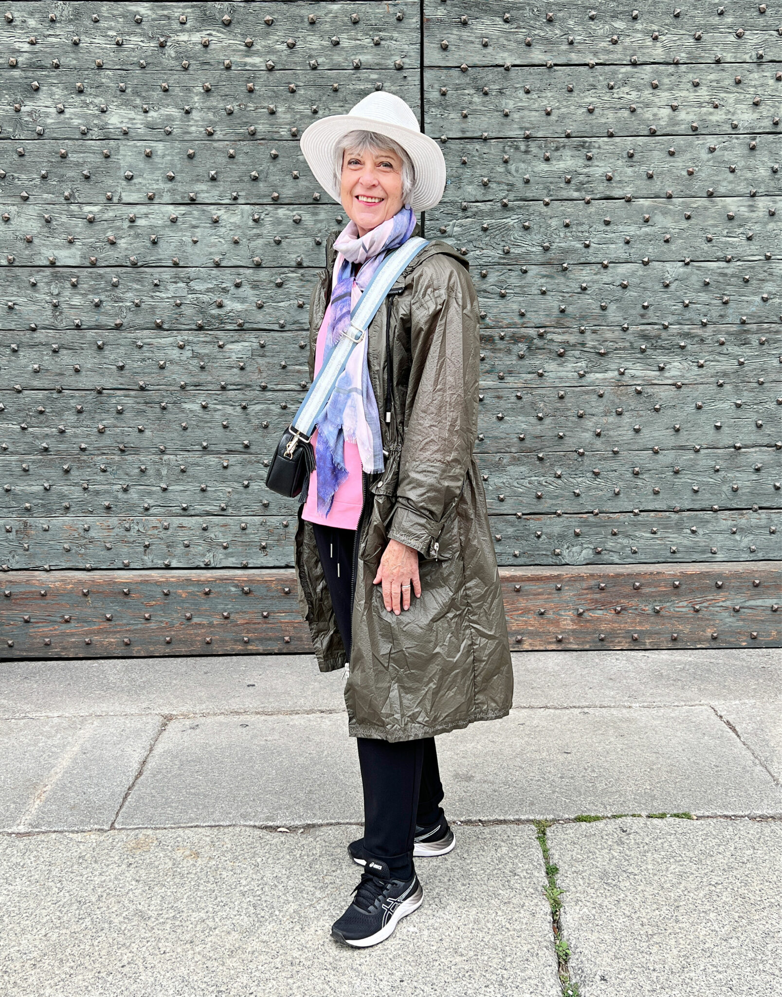 Como Italy in green Mac, scarf and hat
