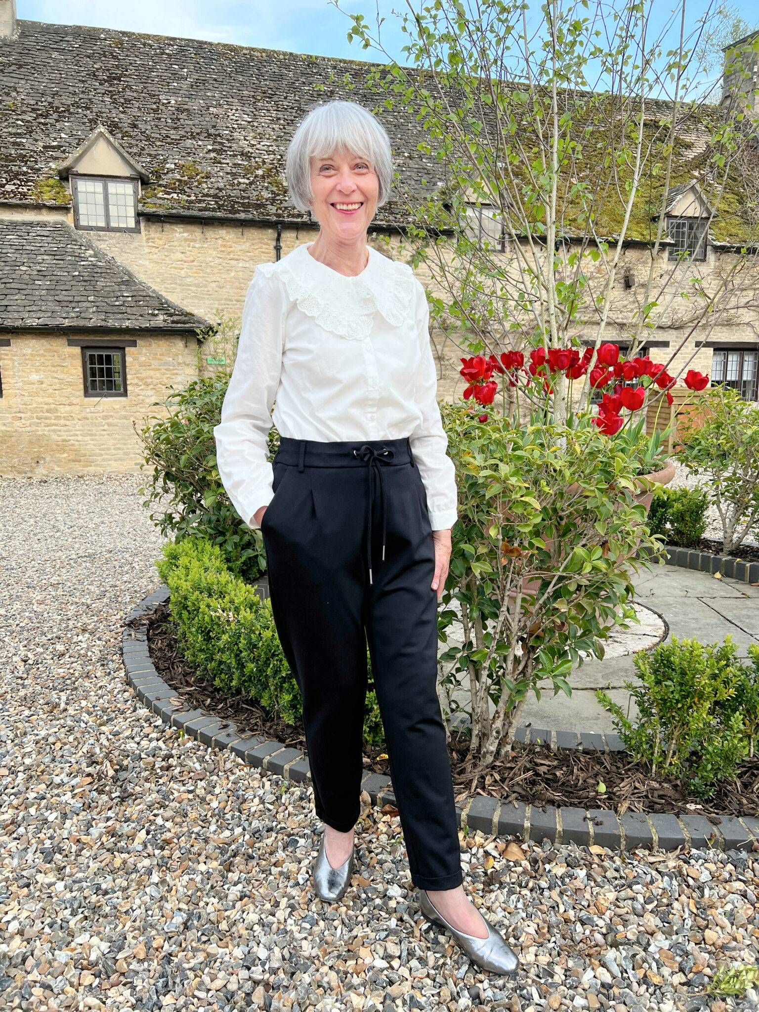 casual evening outfit. White blouse and black trousers