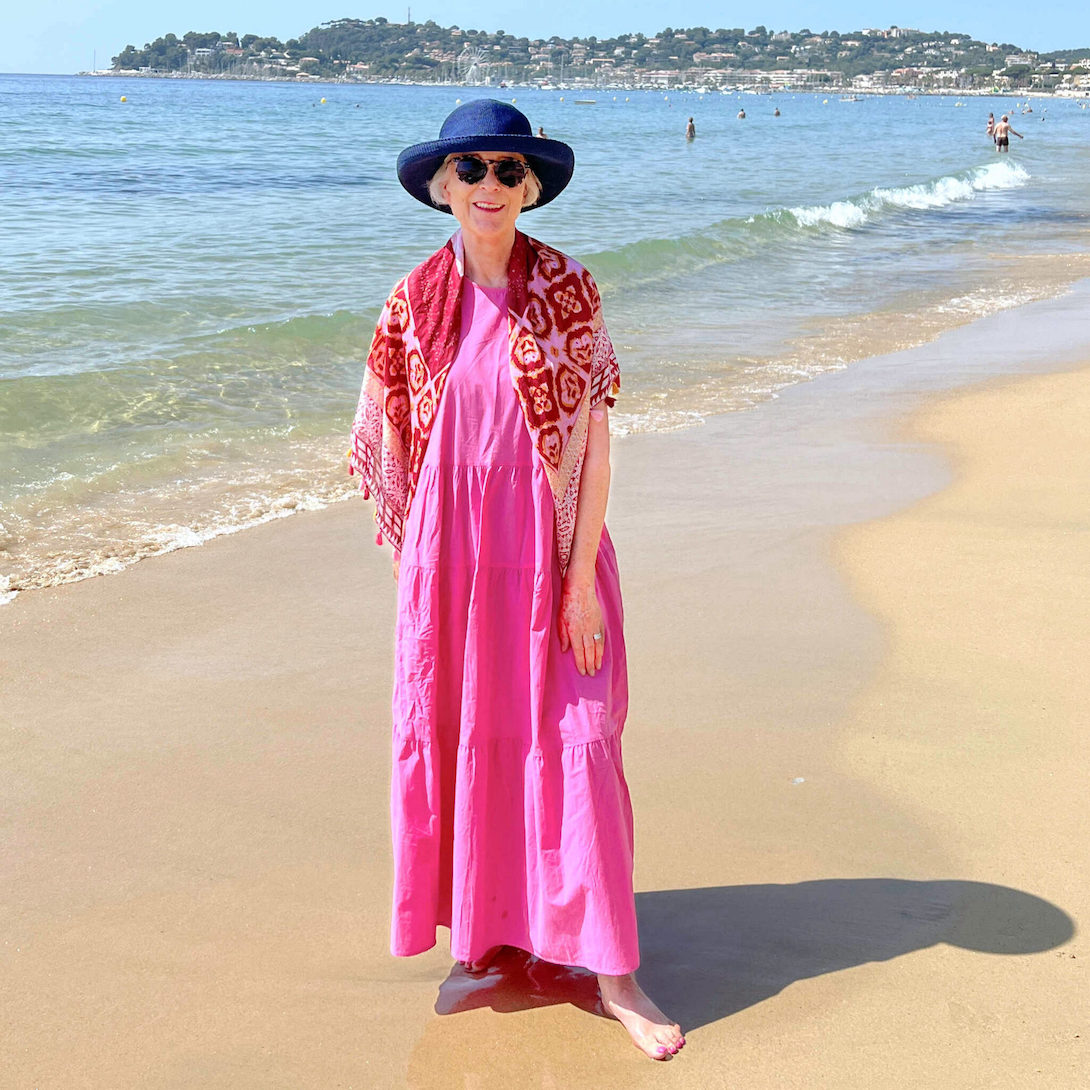 Pink cotton maxi dress on the beach